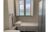 Villa Clitia - Casa vacanze sul mare a Villasimius in Sardegna - camera da letto singola con finestra sulla spiaggia privata.